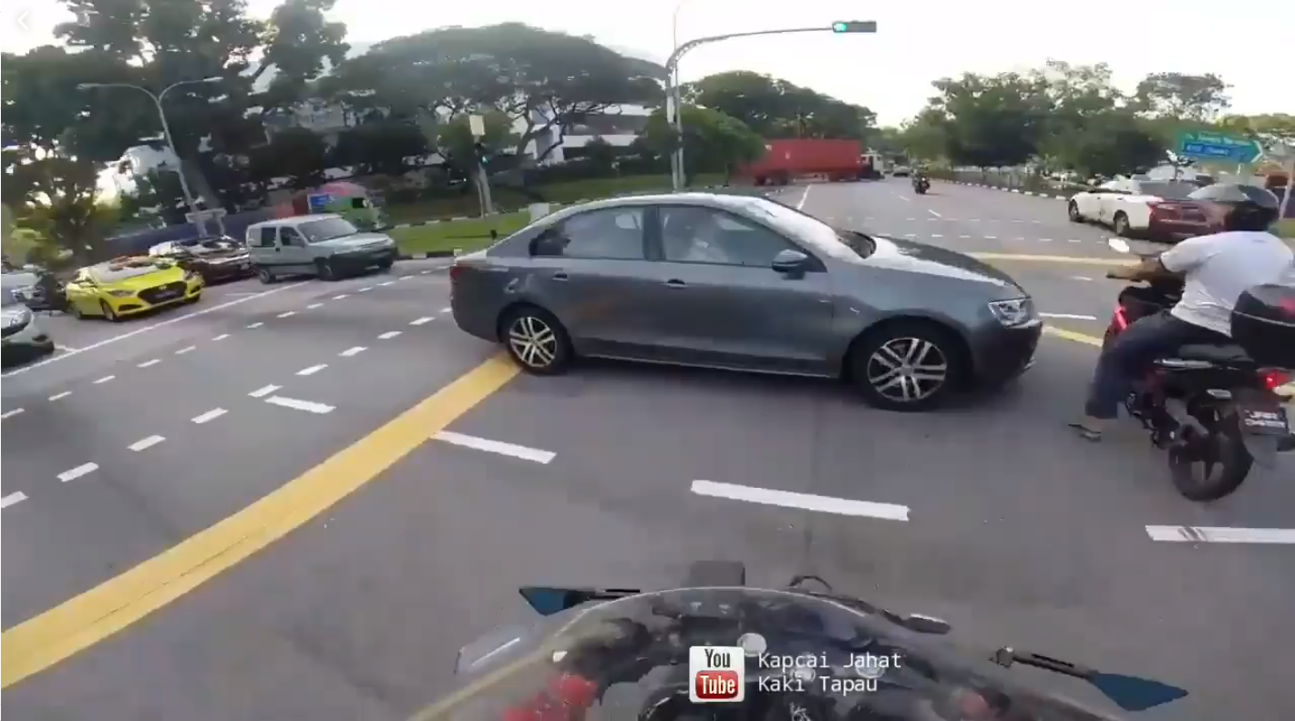 Still sleeping? Driver trying to beat red light and still refuse to reverse!