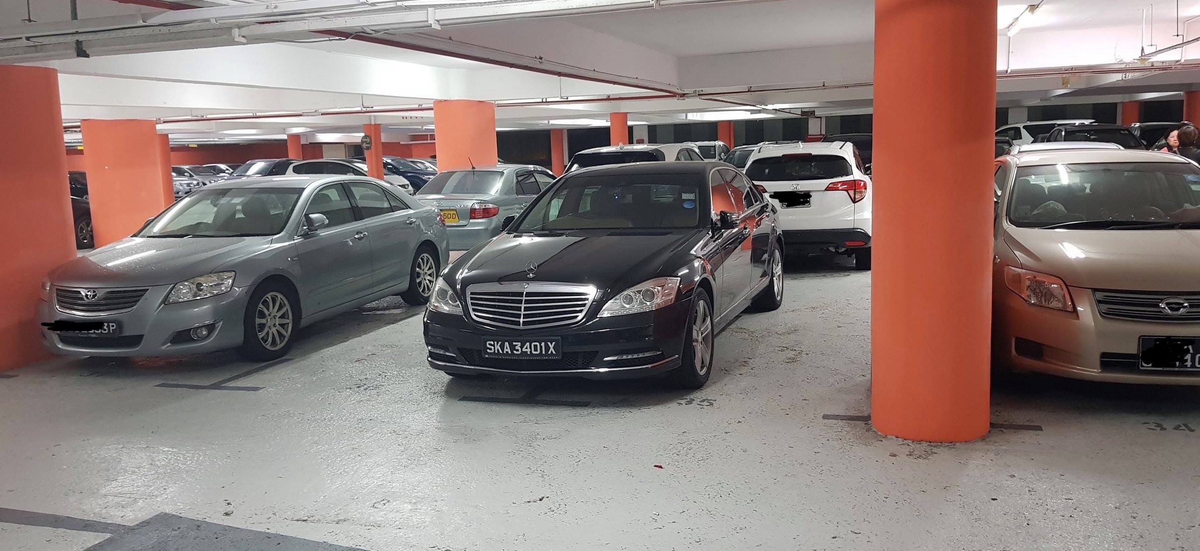 Driver thinks owning a Mercedes means big shot so can take 2 parking lots?