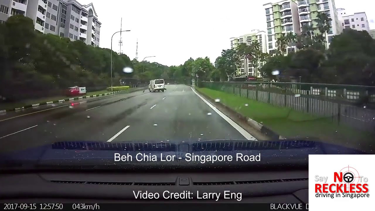 SMRT Taxi hits a van on the wet road and spins out of control!