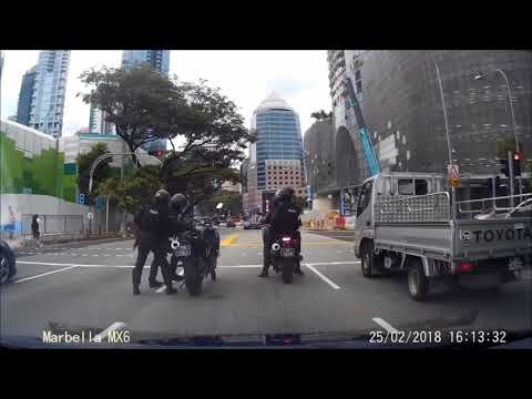 SG police officers having difficulties to balance on motorbike