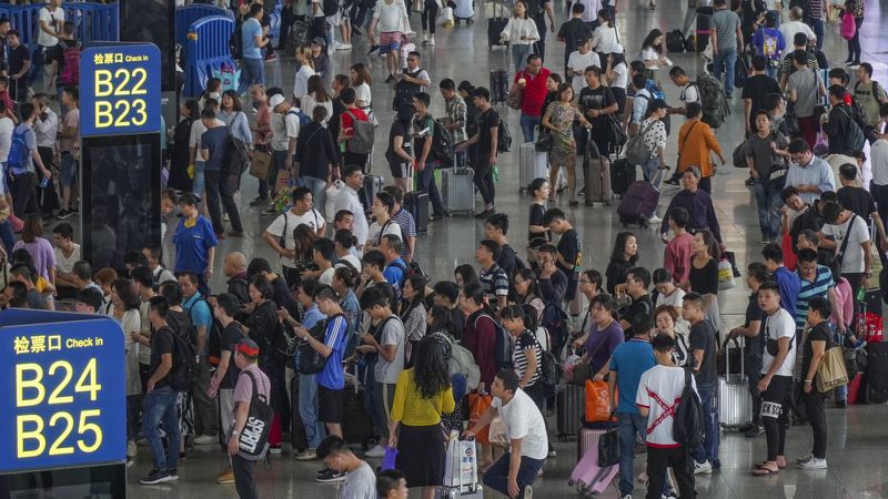 China’s rail operator apologises for holiday travel chaos but says it will seek to punish unruly passengers