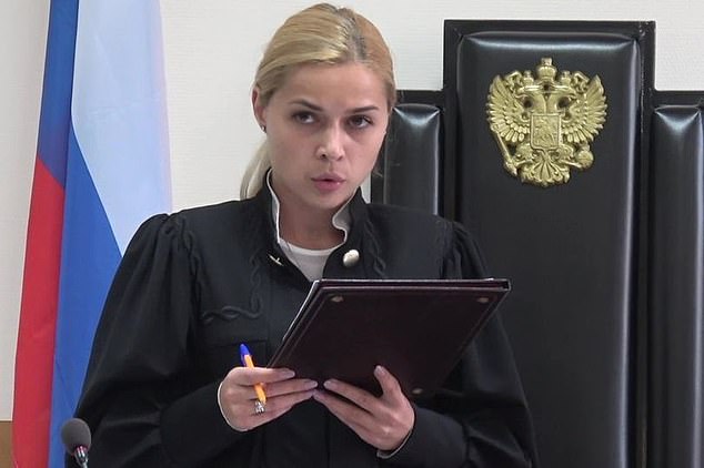 Russian judge resigns over topless selfie 'hacked from her mobile phone' after she released two teenagers charged with trying to overthrow the government