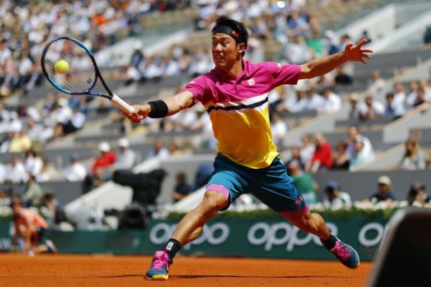 Nishikori downs Tsonga to reach French Open third round