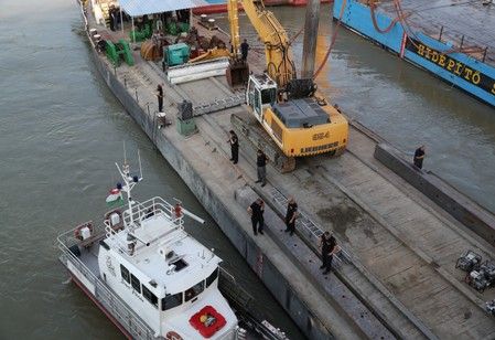 Salvage crews begin lifting hungarian boat sunk in danube