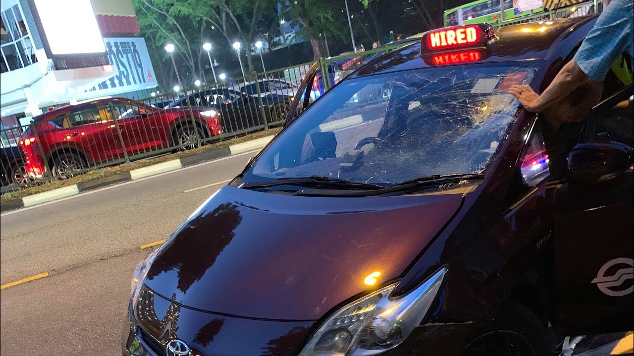 SMRT taxi toyota prius beat the traffic light and plough thru the pedestrians