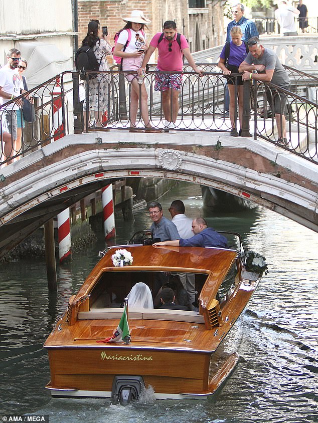 Arsenal midfielder Henrikh Mkhitaryan kisses his beautiful bride Betty Vardanyan as they marry in Venice