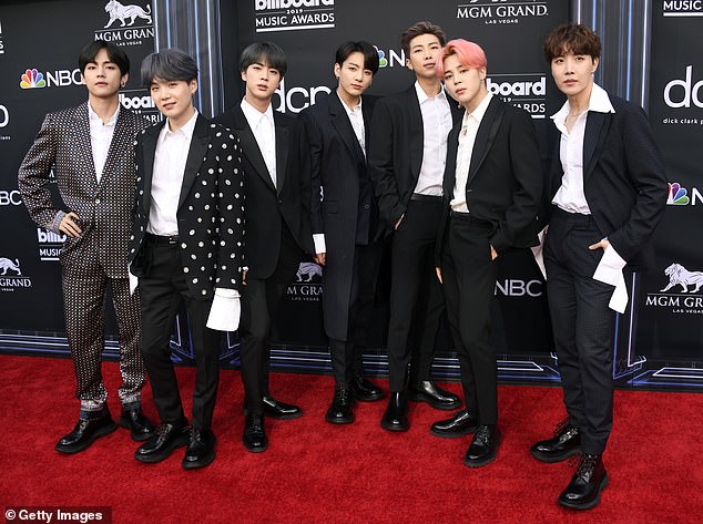 'It's satire!' Fans back Jimmy Carr after the British comedian's joke about K-pop act BTS 'exploding in America' on Australian TV sparked an international race row