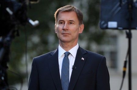 Britain's hunt takes aim at PM rival Johnson's "do or die" Brexit pledge