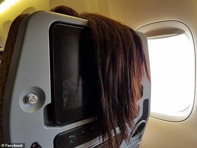 Airline passenger shames woman for 'rudely' hanging her hair over the back of her seat - but not everyone is on his side
