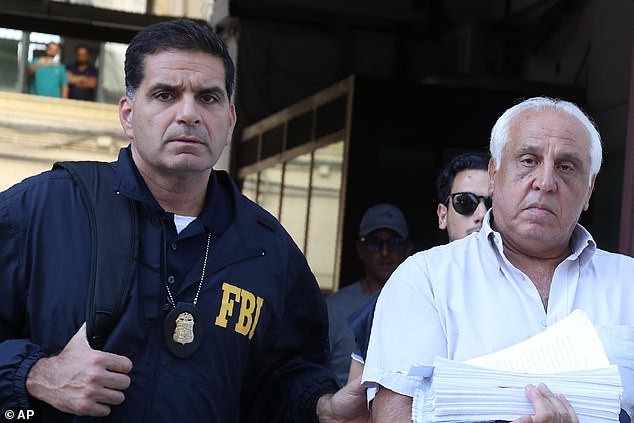 Police and the FBI carry out raids targeting New York's Gambino family and the Inzerillo Mafia in Italy where the US mobsters have helped the Sicilians rebuild their powerbase