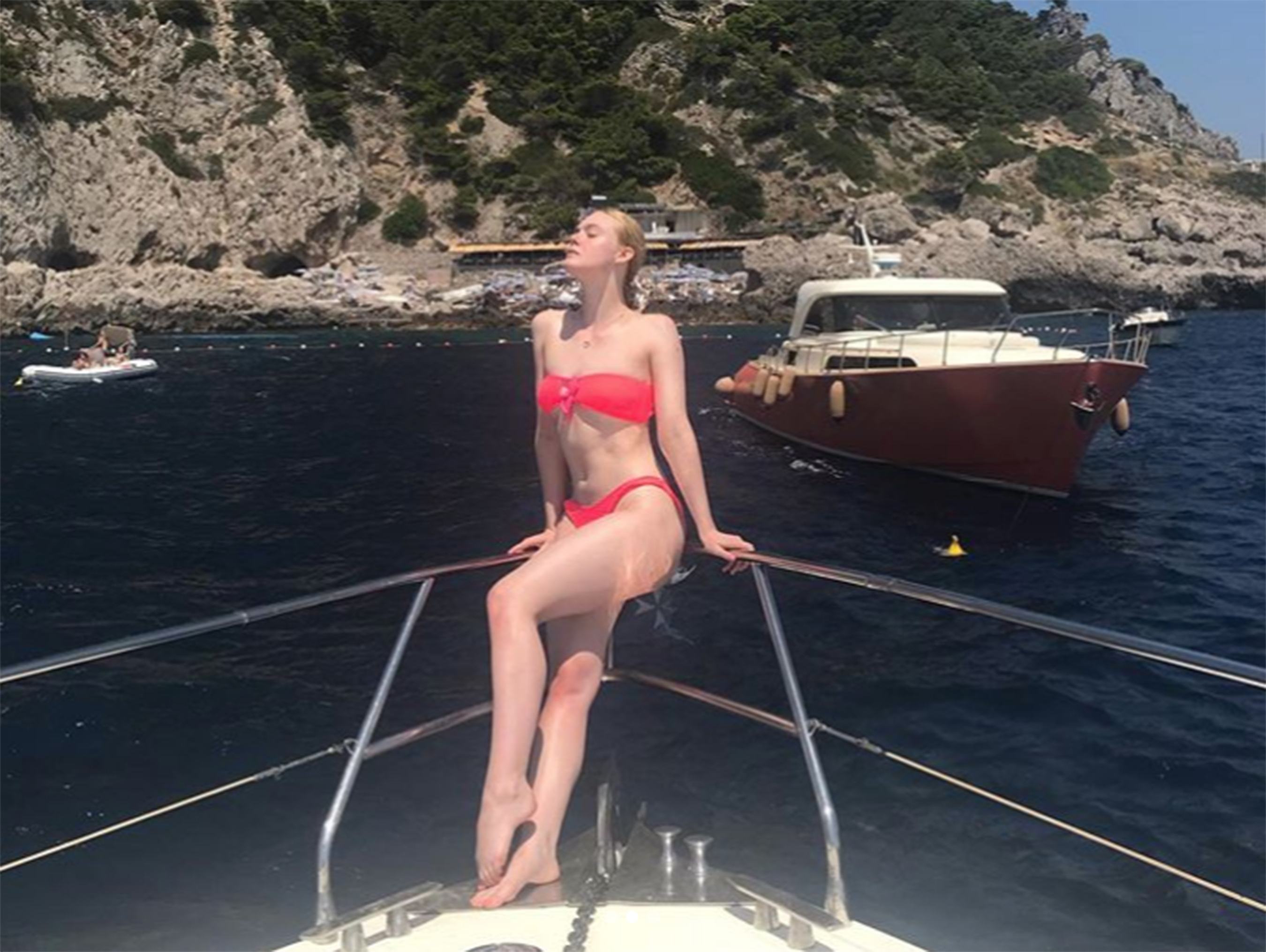 Elle Fanning Steals Sister Dakota Fanning's Pink Bikini for Italian Getaway