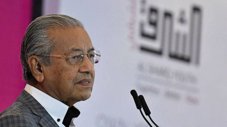 Tun M urges smallholders to merge to increase profits