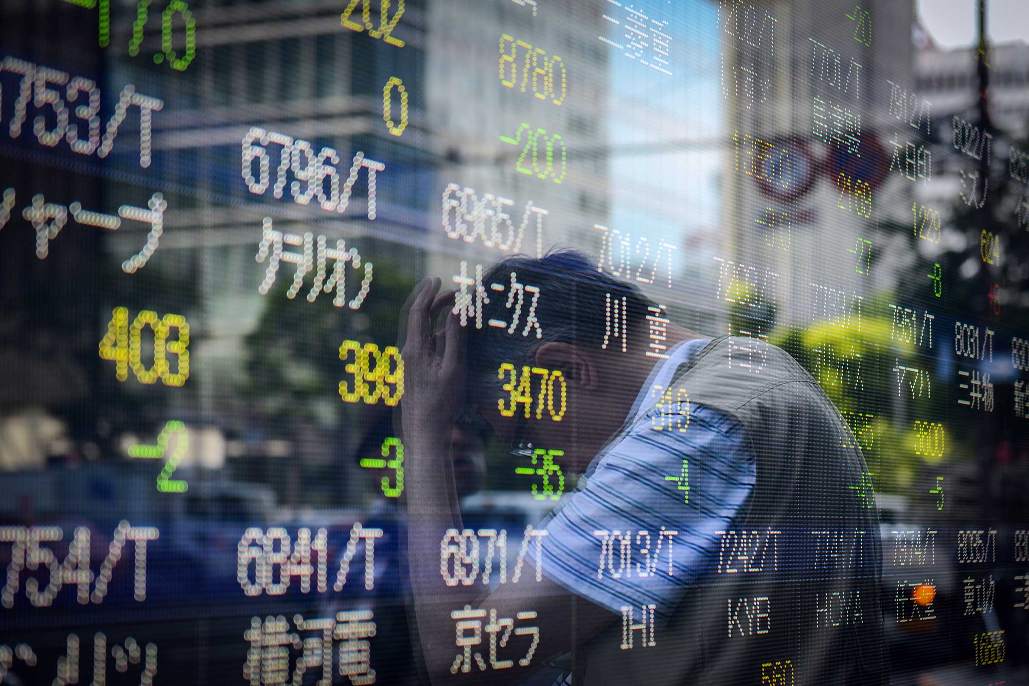 Japan stocks track Wall Street higher, but virus worries weigh