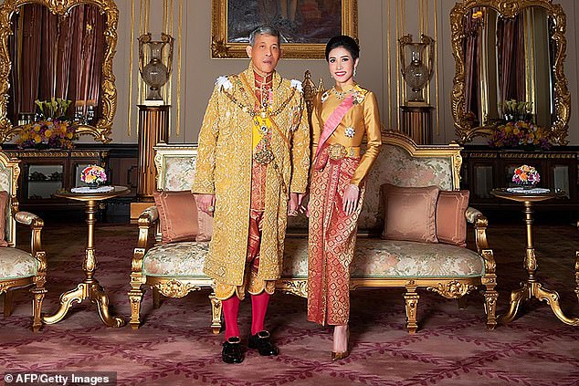 Thai king 'releases his concubine from jail and flies her to Germany to join his harem' a year after she was stripped of royal titles