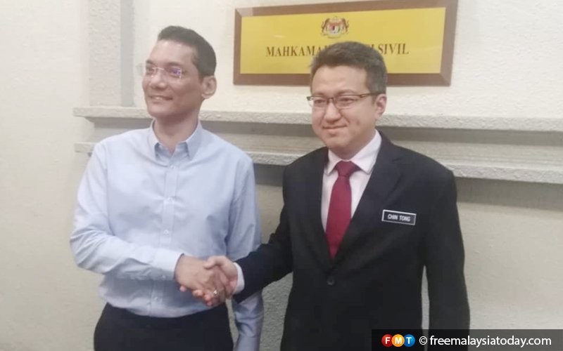 Chin Tong settles ‘communist uniform’ defamation suit