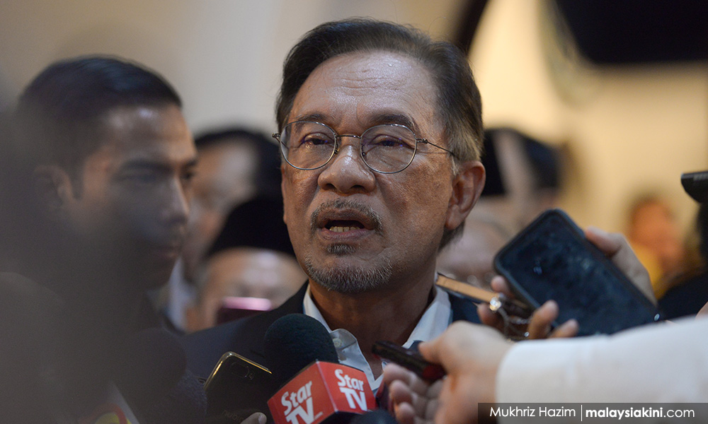 Anwar dodges poser on aide's 'rioting' charge