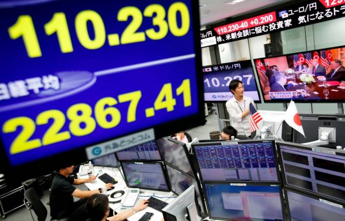 Japanese shares edge lower as cautious traders watch Trump-Biden debate
