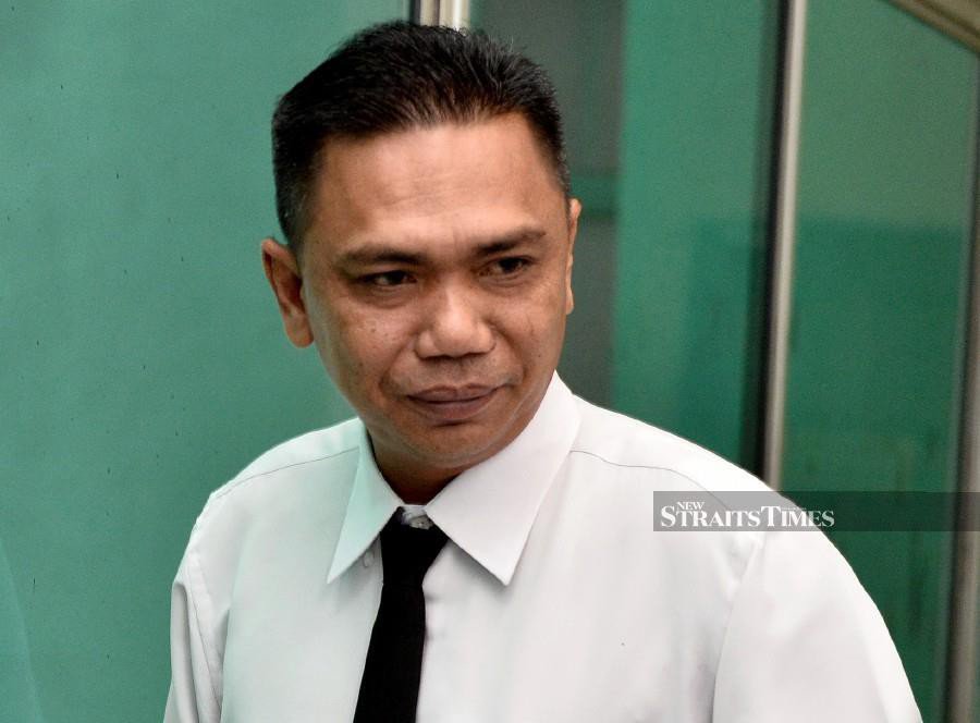 Blood on Cradle Fund CEO's body was still wet, says police photographer