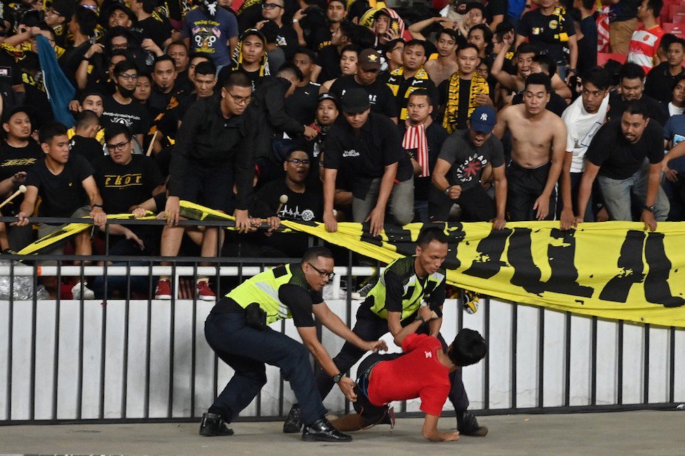 Malaysian Fans Attacked At FIFA Qualifiers After Harimau Malaya Bags Win Against Indonesia