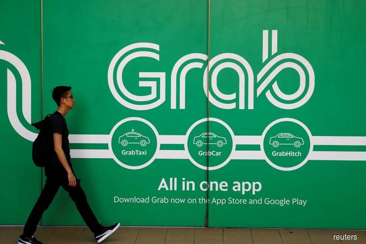 Grab, Razer, AirAsia exploring bids for Malaysia digital bank licence — sources