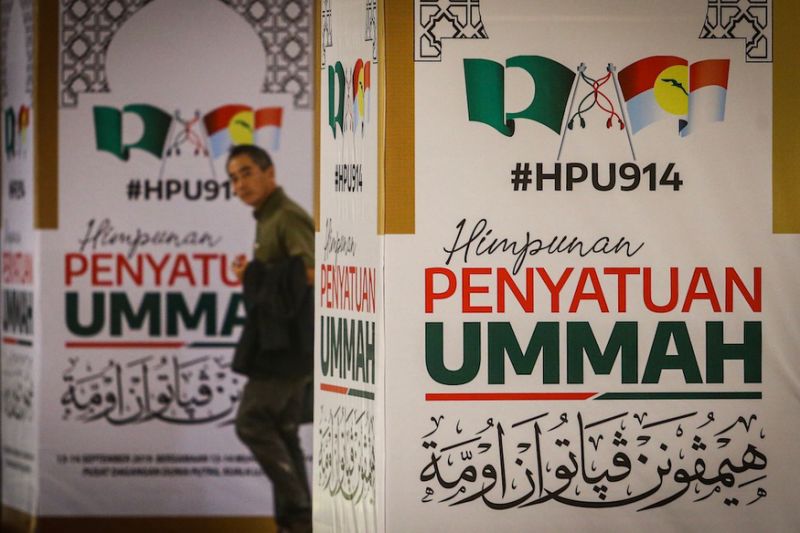 Umno, PAS supporters pack PWTC to witness union of once-bitter enemies