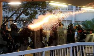 Hong Kong on edge as police fire tear gas at university campus