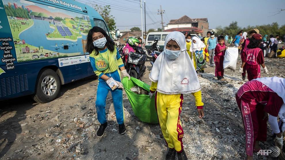 Activists across Asia get down and dirty clearing rubbish on mass cleanup day