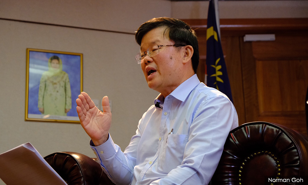 Aide lodges police report over claim Penang CM ordered MyKad for foreigners