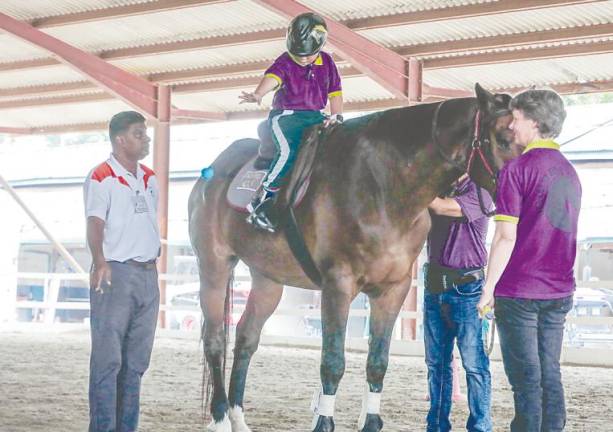 Ex-navy officer finds joy in giving horse-riding therapy for children with special needs