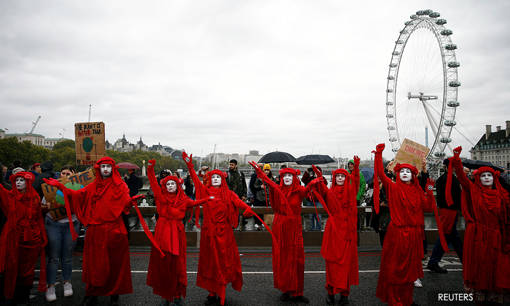 'Sorry, this is an emergency': Climate protesters block streets around the world