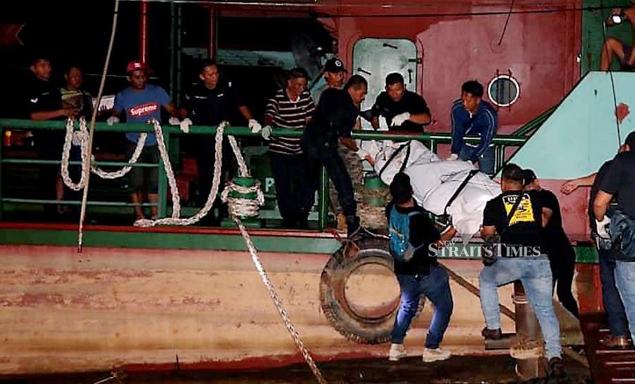 Body of tattooed man tied with 12 bricks found at Sungai Rajang jetty