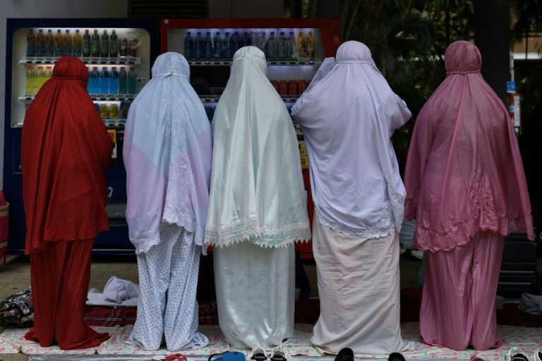 Hong Kong's domestic workers dodge tear gas and clashes
