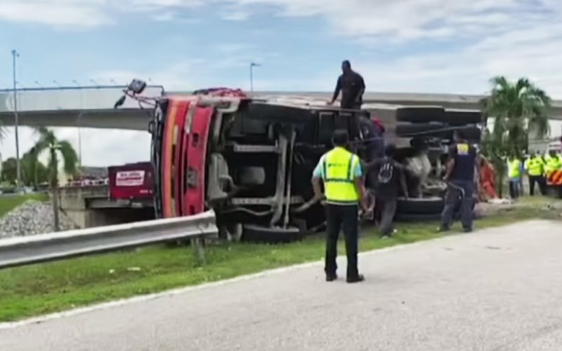 Two women die after lorry overturns and crushes car