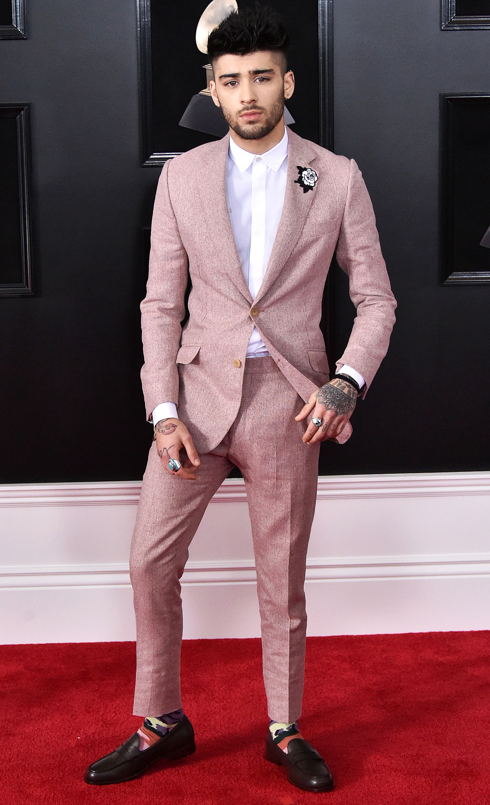 Harry Styles Shades Former Bandmate Zayn Malik — and Takes Off His Pants — in SNL Hosting Debut