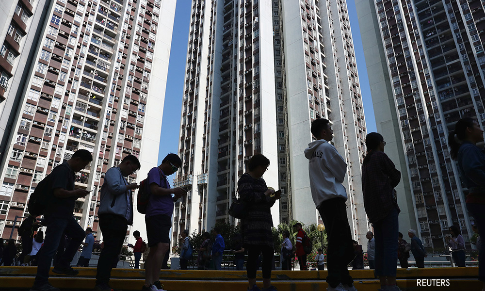Landslide democratic win in Hong Kong election raises pressure on city's leader