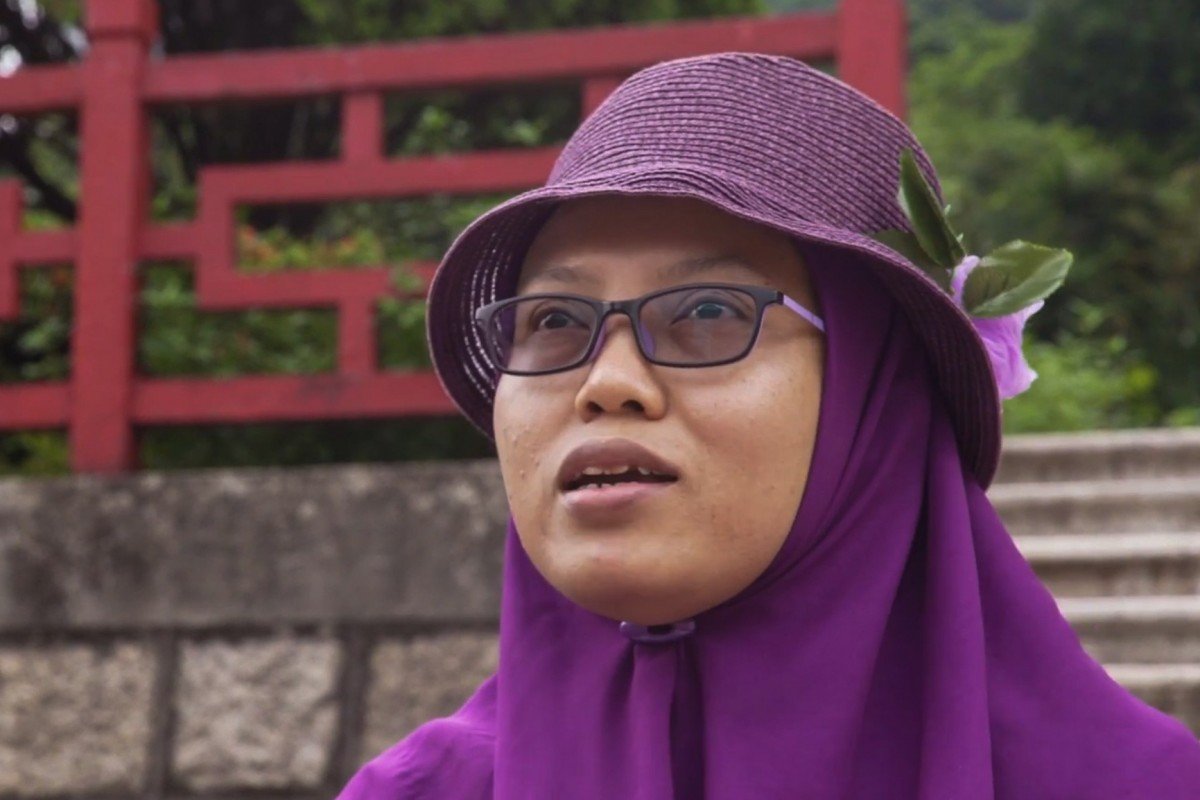 Immigration officials deport Indonesian domestic worker who covered Hong Kong protests as a citizen journalist and was arrested for overstay