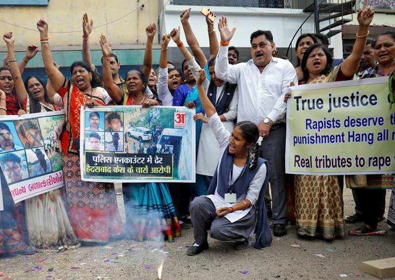 Indian police shoot dead 4 men accused of killing vet, drawing cheers