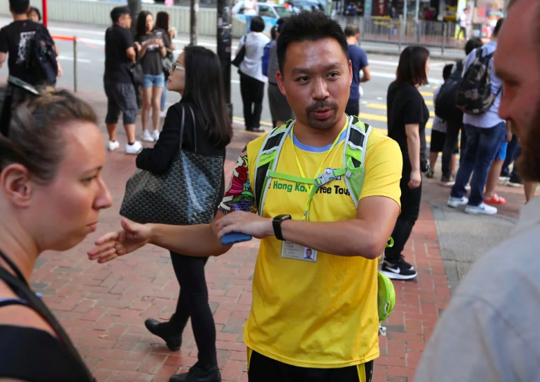 Not your usual day out for a tourist in Hong Kong: Curious visitors join walking tours to see protests