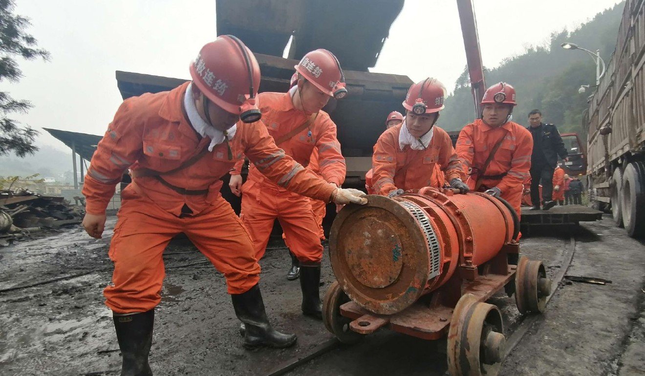 Flood at Chinese coal mine kills four, leaves 14 trapped