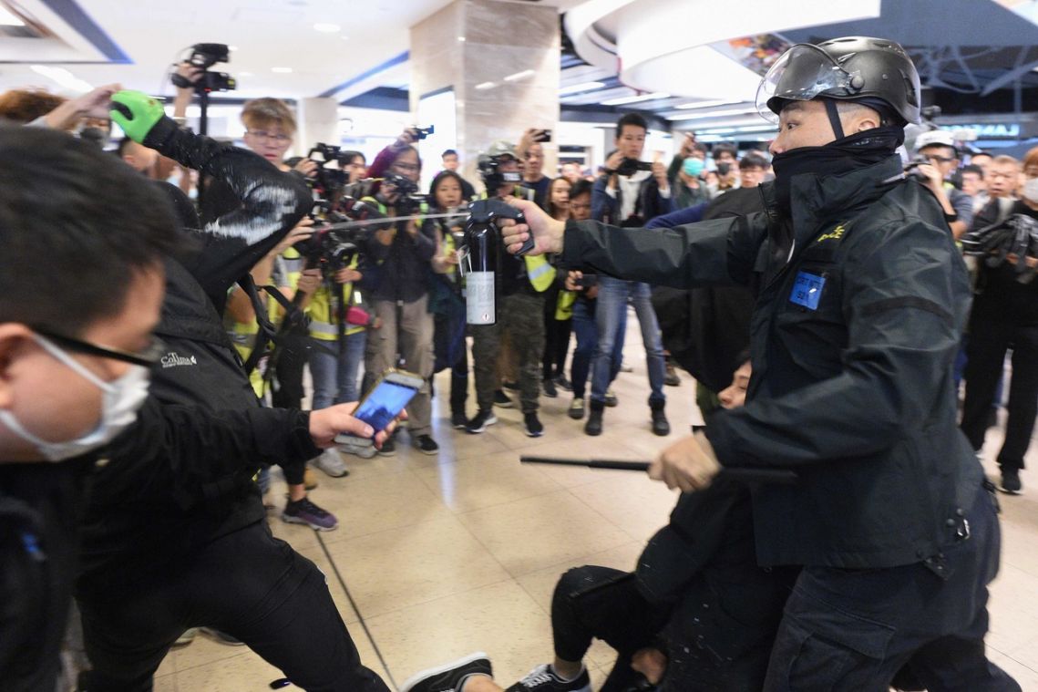Hong Kong mall protests flare with leader Lam in Beijing