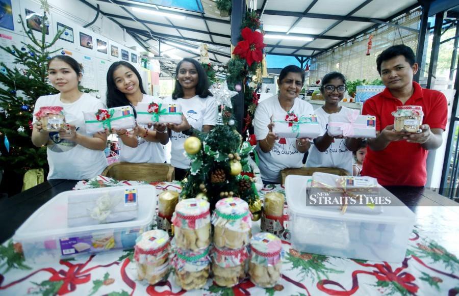 Children bake fruit cakes for X'mas to raise funds