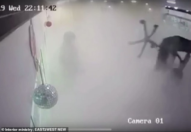 Shop workers fight off robber armed with a gun and a GRENADE after snatching his firearm and spraying him with a fire extinguisher at a Russian mobile phone store