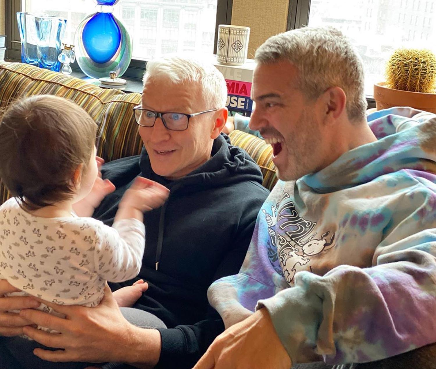 Andy Cohen's Son, 10 Months, Knocks Off Anderson Cooper's Glasses Ahead of Dad's NYE Hosting Gig
