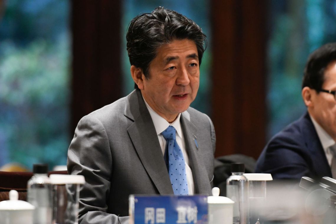Japan's Shinzo Abe plays golf as officials stay silent over Carlos Ghosn