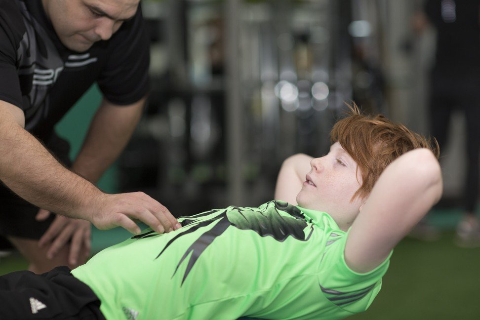 Kids gym: the children working out in fitness centres to build strength, improve their movement and sports performance