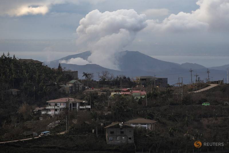 Philippine residents retrieve animals, belongings amid threat of volcano eruption