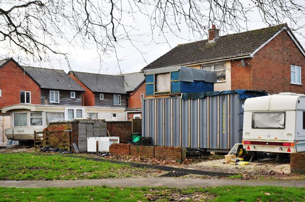 Neighbours outraged after shipping container 'extension' dumped in front garden