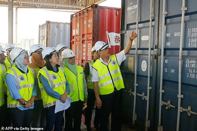 Shipping containers filled with plastic waste are sent back to countries including Britain and the US after Malaysia declares 'we are not the world's garbage dump'