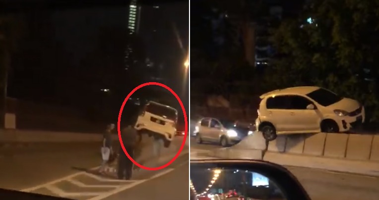Video: “Flying” Myvi Gets Stuck On Top Of Divider at JB, Netizens Amazed