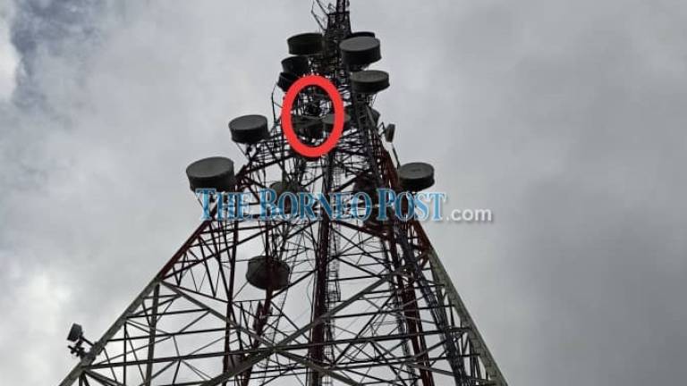 Unidentified man spends the night on Bukit Memaloh tower, attempts to talk him down resumes